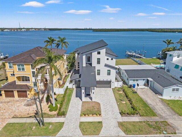 birds eye view of property with a residential view and a water view