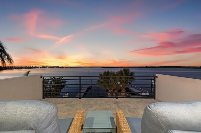 bedroom featuring a water view