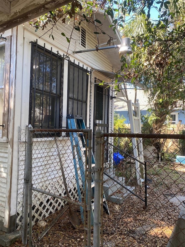 view of side of home with fence