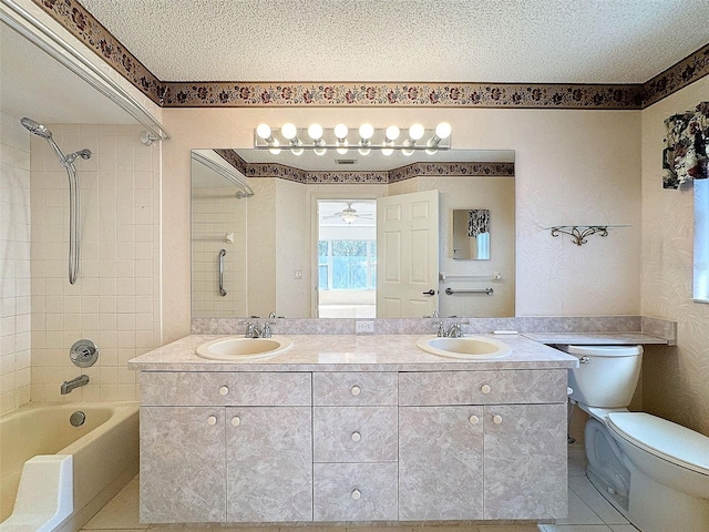 bathroom featuring a sink, a textured ceiling, and toilet