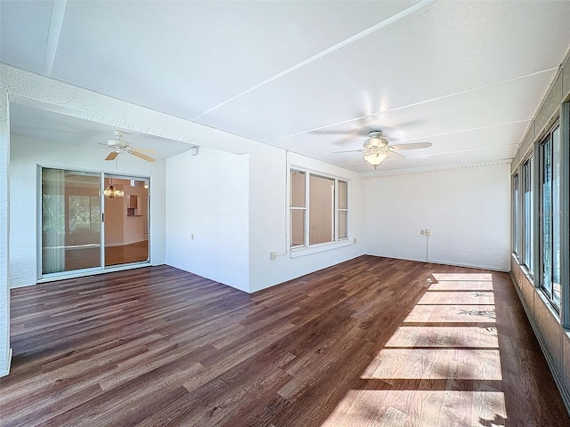 unfurnished sunroom with ceiling fan