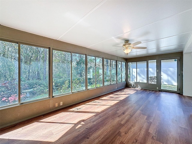 unfurnished sunroom with ceiling fan