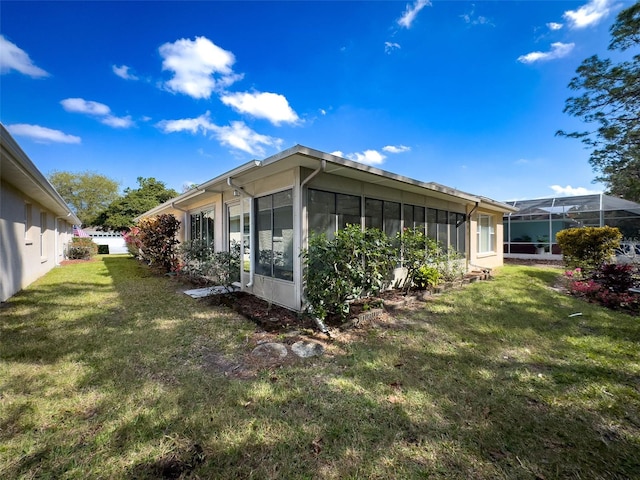 view of property exterior with a yard