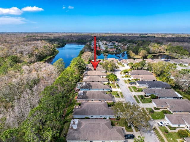 bird's eye view featuring a water view, a residential view, and a view of trees