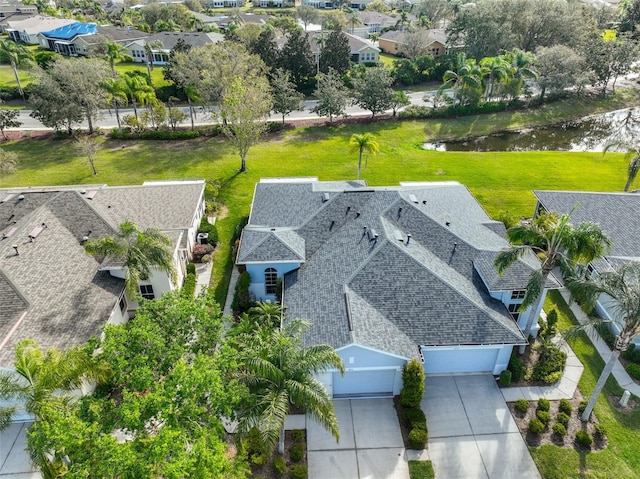 aerial view with a water view and a residential view