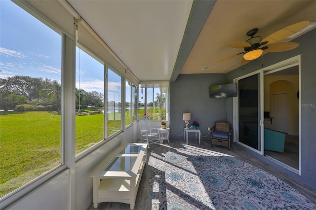 sunroom with visible vents and a ceiling fan