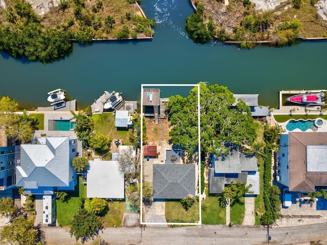 bird's eye view featuring a residential view and a water view