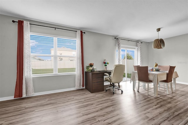 office featuring baseboards and wood finished floors