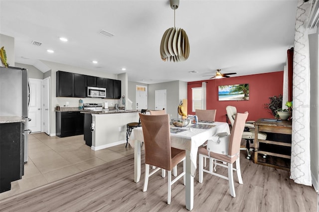 dining space with a ceiling fan, recessed lighting, visible vents, and light wood-style flooring