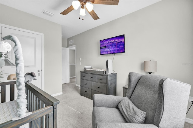 bedroom featuring carpet floors, a ceiling fan, visible vents, and baseboards