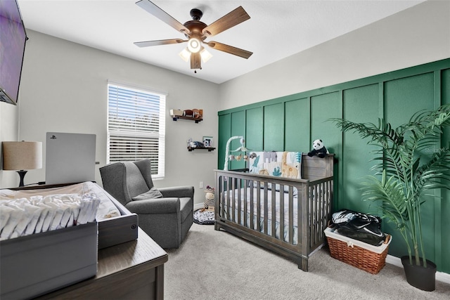 bedroom featuring carpet, baseboards, and a ceiling fan