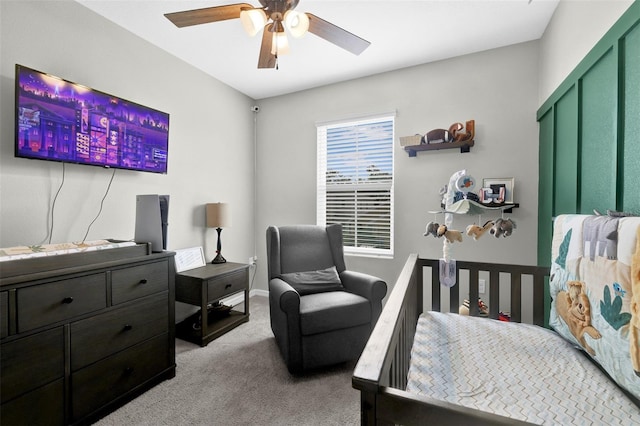 bedroom with ceiling fan and light colored carpet