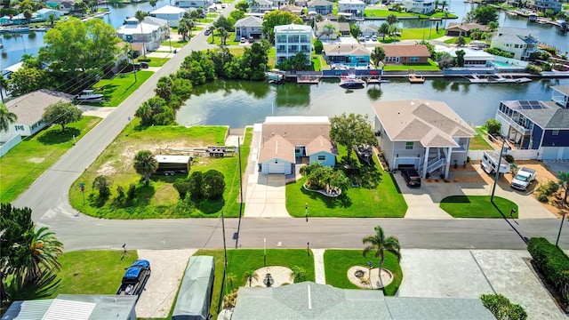 birds eye view of property featuring a residential view and a water view