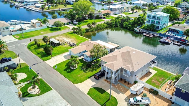 bird's eye view featuring a water view and a residential view