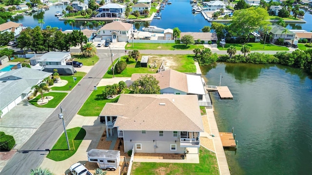 birds eye view of property featuring a residential view and a water view