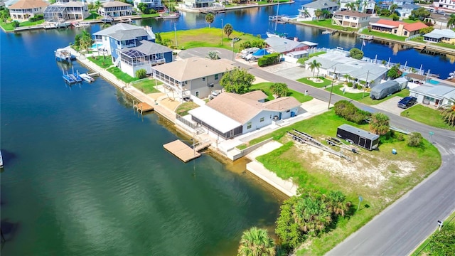 aerial view featuring a residential view and a water view