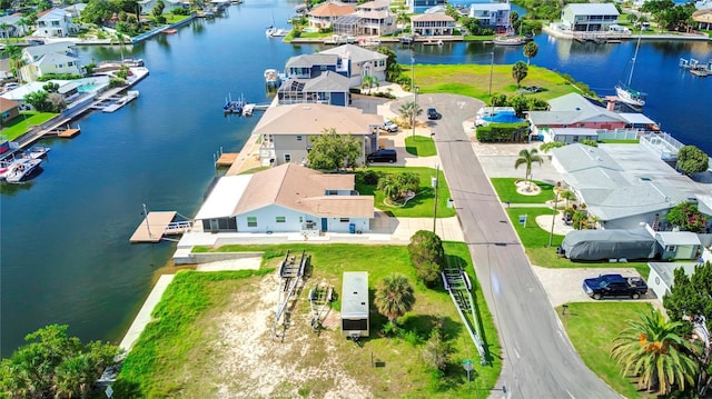 aerial view featuring a water view and a residential view