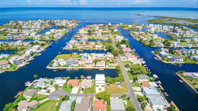 bird's eye view with a water view and a residential view