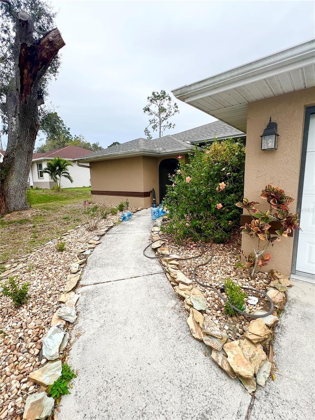 view of property exterior with stucco siding