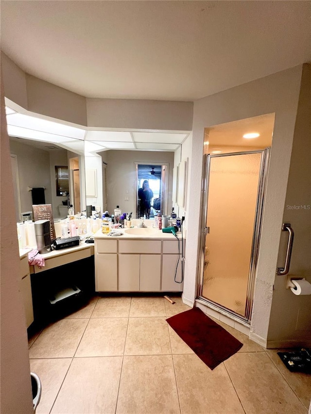 full bath featuring a shower stall, tile patterned flooring, and vanity