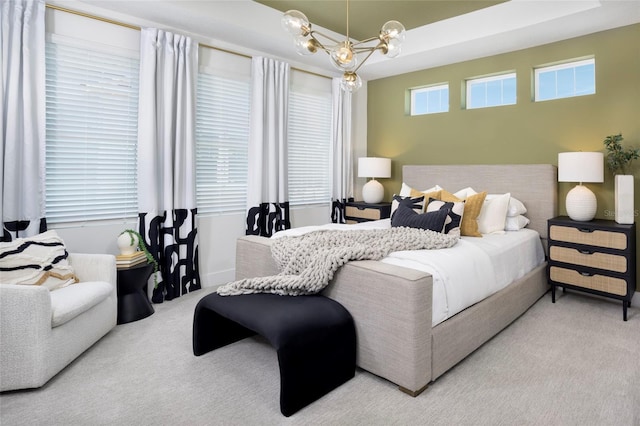 bedroom featuring a chandelier and carpet flooring