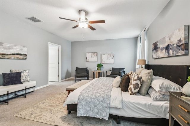 bedroom with visible vents, baseboards, carpet, and ceiling fan