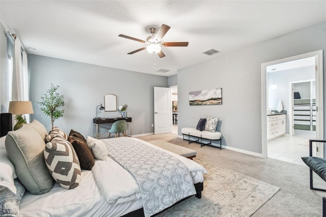 bedroom with visible vents, light carpet, baseboards, and a ceiling fan