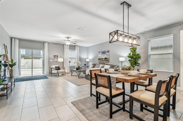 dining room featuring ceiling fan and light tile patterned flooring