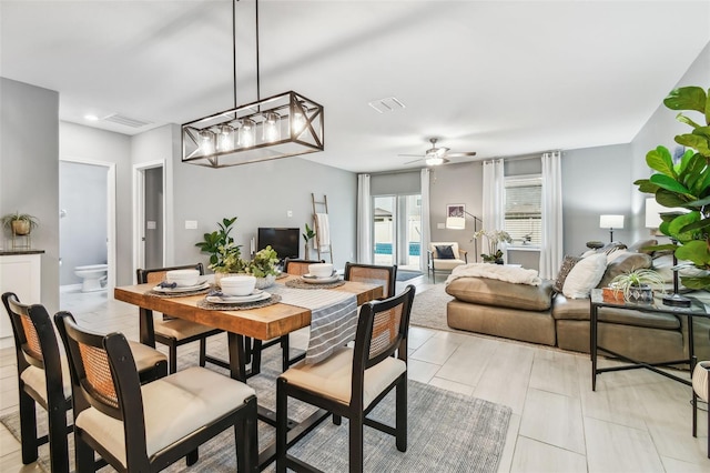 dining area with visible vents and ceiling fan