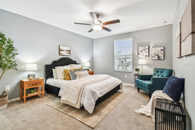 bedroom with baseboards, carpet floors, and a ceiling fan