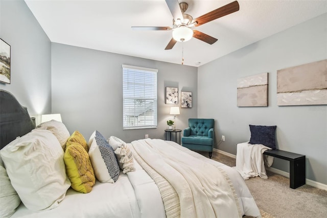 carpeted bedroom with baseboards and ceiling fan