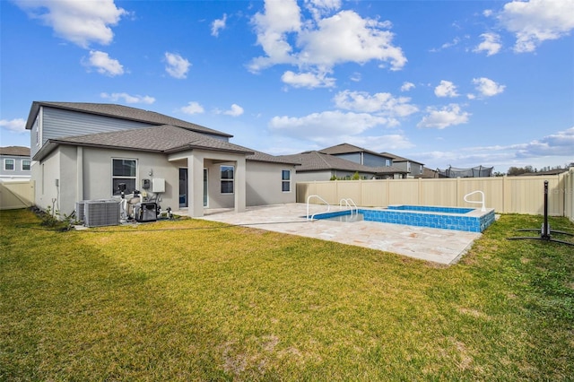 back of house with a fenced in pool, a yard, a fenced backyard, central AC, and a patio area