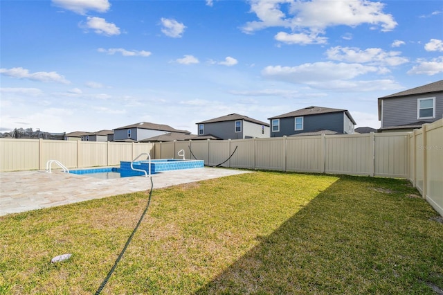 view of yard with a residential view, a patio area, a fenced in pool, and a fenced backyard