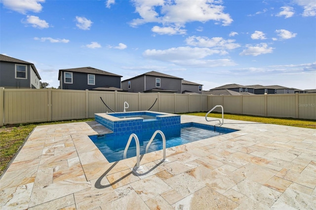 view of pool with a patio, a fenced backyard, and a pool with connected hot tub