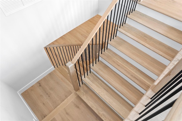 staircase featuring wood finished floors