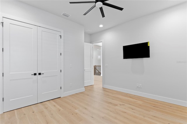 unfurnished bedroom featuring visible vents, baseboards, light wood-style flooring, a closet, and recessed lighting