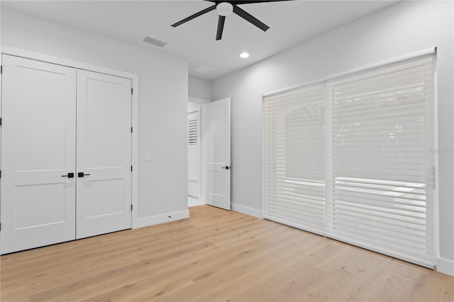 unfurnished bedroom featuring light wood finished floors, recessed lighting, visible vents, and baseboards