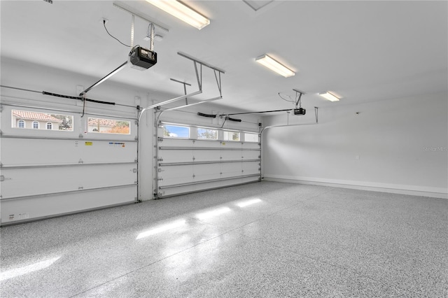 garage featuring baseboards and a garage door opener