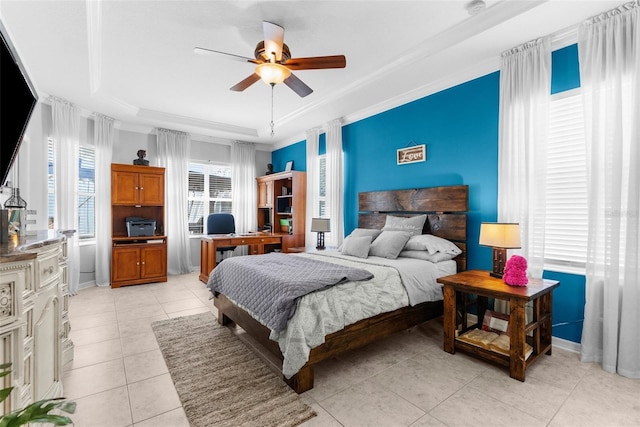 bedroom featuring crown molding, light tile patterned floors, a raised ceiling, ceiling fan, and baseboards