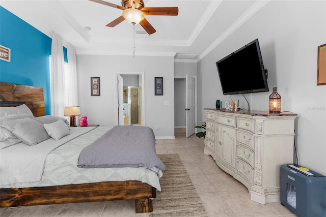 bedroom with light tile patterned floors, baseboards, ceiling fan, a tray ceiling, and crown molding