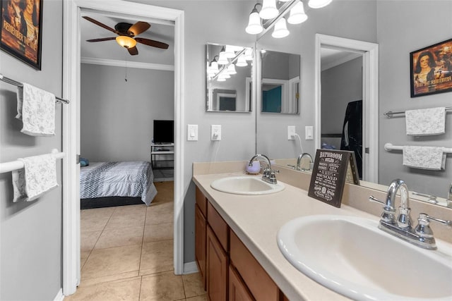 full bath with crown molding, tile patterned flooring, a sink, and ensuite bath