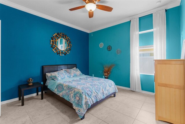 bedroom featuring baseboards, ornamental molding, a ceiling fan, and tile patterned floors