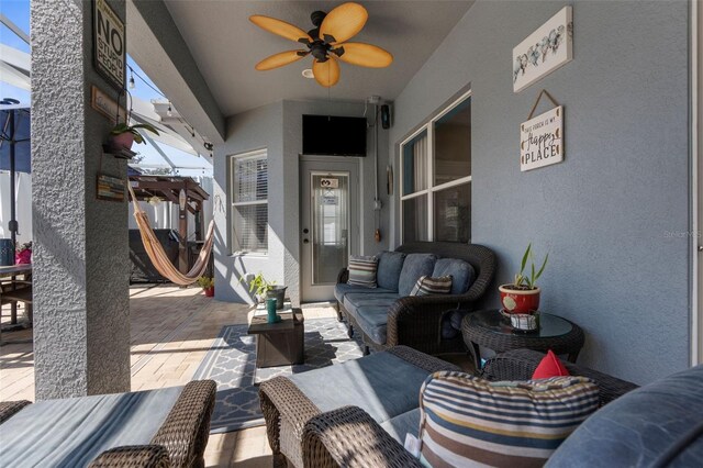 view of patio / terrace featuring a ceiling fan and outdoor lounge area