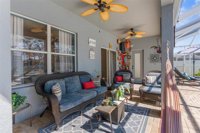 sunroom featuring ceiling fan