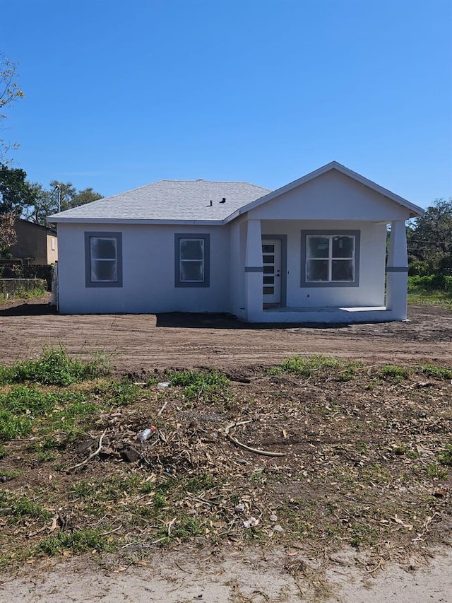 ranch-style house with stucco siding