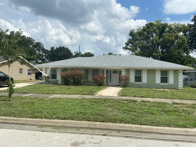 ranch-style home with a front yard