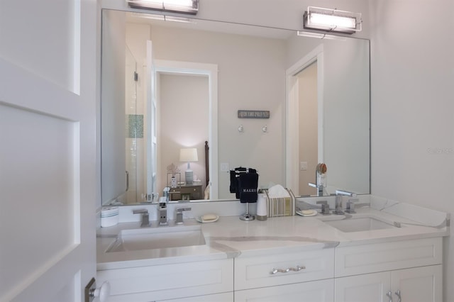 bathroom featuring double vanity and a sink