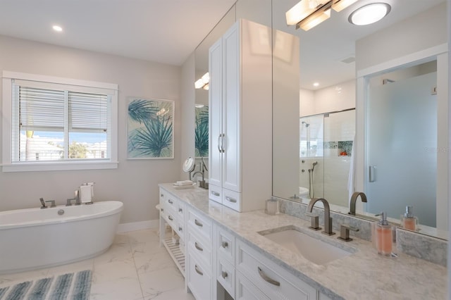 bathroom featuring a sink, baseboards, marble finish floor, a shower stall, and double vanity