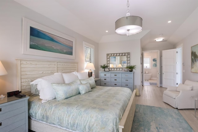 bedroom featuring multiple windows, wood finished floors, and recessed lighting