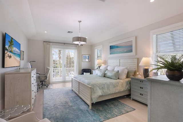 bedroom featuring light wood-style floors, recessed lighting, access to exterior, and visible vents